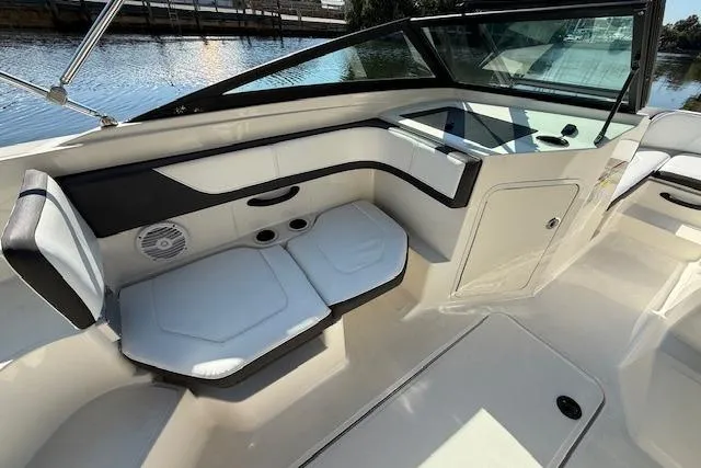 Slide: The Image of 2017 Sea Ray SPX 190 Outboard boat interior with white seating and black accents. - 19