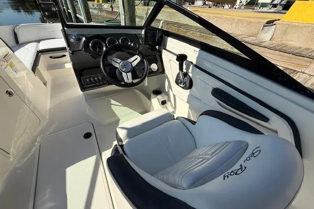 Slide: The Image of 2017 Sea Ray SPX 190 Outboard boat interior with steering wheel and seating. - 21
