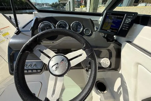 Slide: The Image of 2017 Sea Ray SPX 190 Outboard dashboard with steering wheel and navigation system. - 22