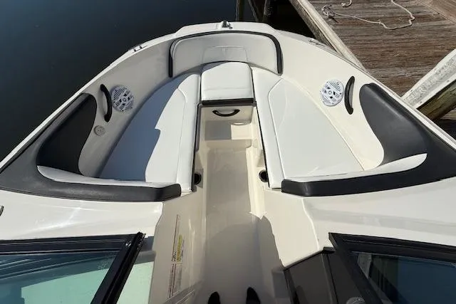 Slide: The Image of 2017 Sea Ray SPX 190 Outboard boat interior with white seating and black accents. - 23