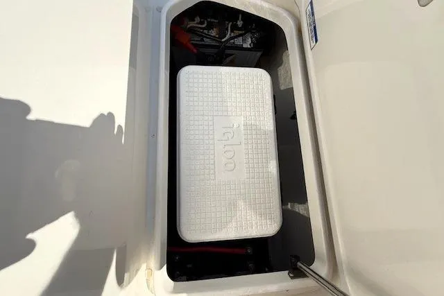 Slide: The Image of Storage compartment with Igloo cooler in 2017 Sea Ray SPX 190 Outboard boat. - 26