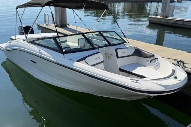 Slide: The Image of 2017 Sea Ray SPX 190 Outboard boat docked on calm water. - 5