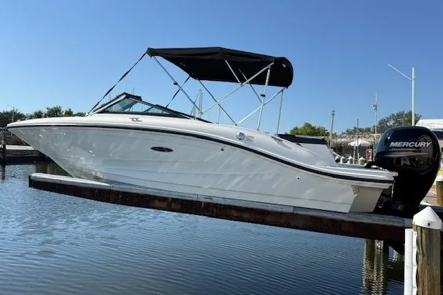 Slide: The Image of 2017 Sea Ray SPX 190 Outboard boat with black canopy on calm water. - 6
