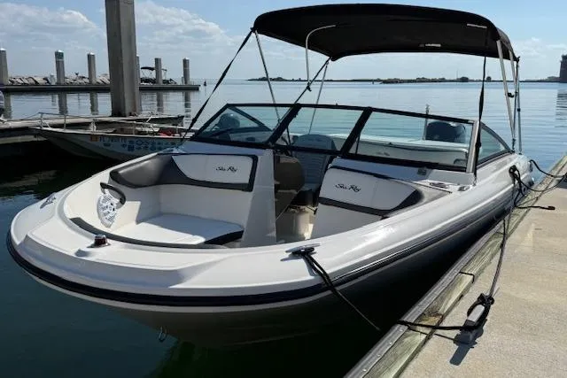 Slide: The Image of 2017 Sea Ray SPX 190 Outboard boat docked by the water. - 7