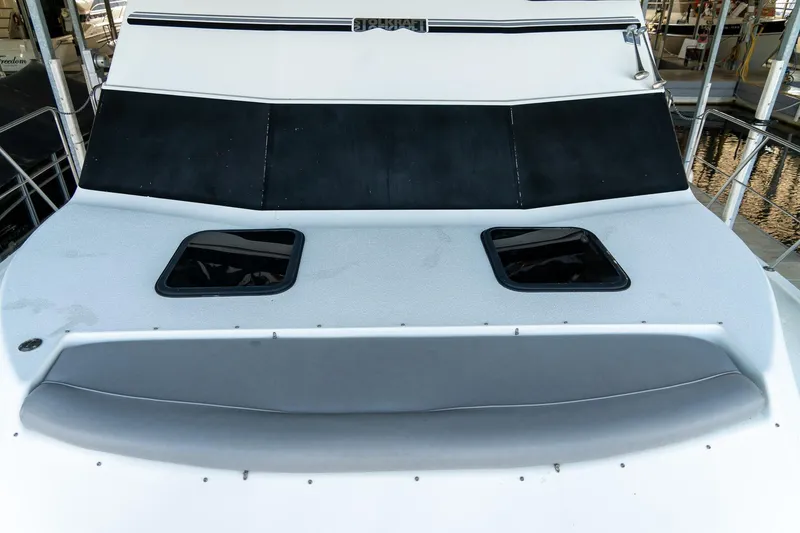 Slide: The Image of 1997 Harbor Master Stolkraft boat deck with windows and seating area. - 39