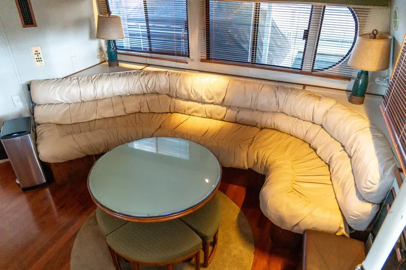 Slide: The Image of Luxurious 1997 Harbor Master Stolkraft interior with plush seating and round glass table. - 41