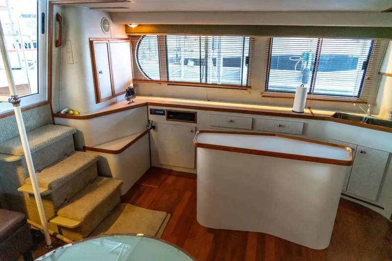 Slide: The Image of Interior of 1997 Harbor Master Stolkraft yacht with wooden flooring and modern kitchen. - 43