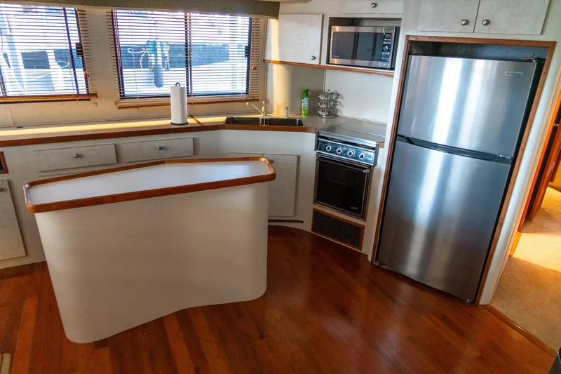 Slide: The Image of 1997 Harbor Master Stolkraft kitchen with modern appliances and wooden flooring. - 44