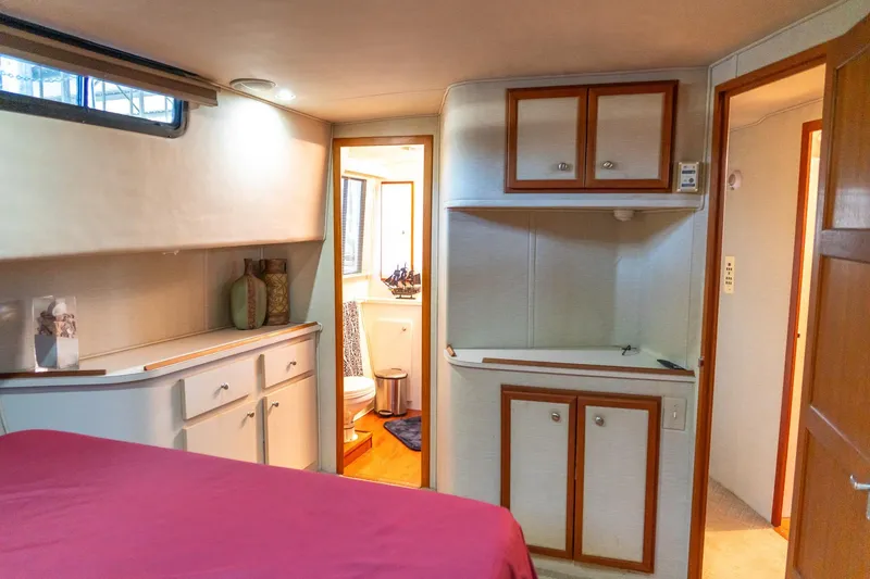 Slide: The Image of 1997 Harbor Master Stolkraft interior with cozy bedroom and bathroom view. - 49