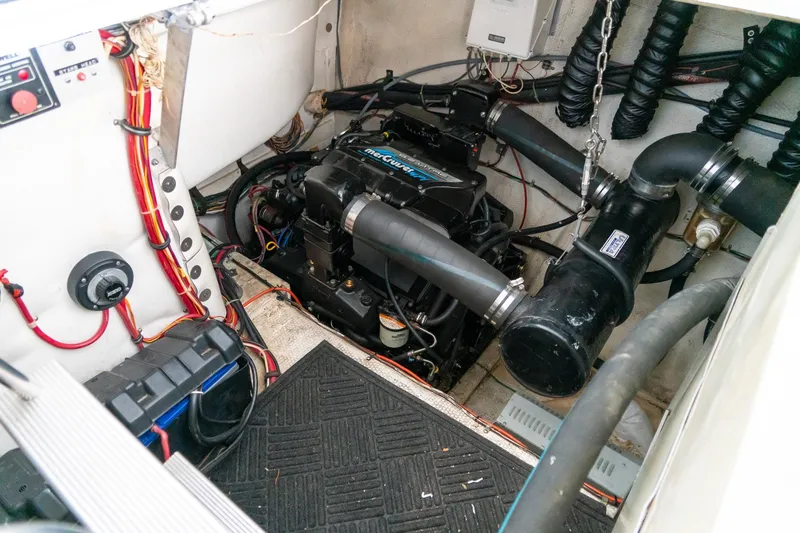 Slide: The Image of Engine room of a 1997 Harbor Master Stolkraft boat with visible wiring and components. - 55
