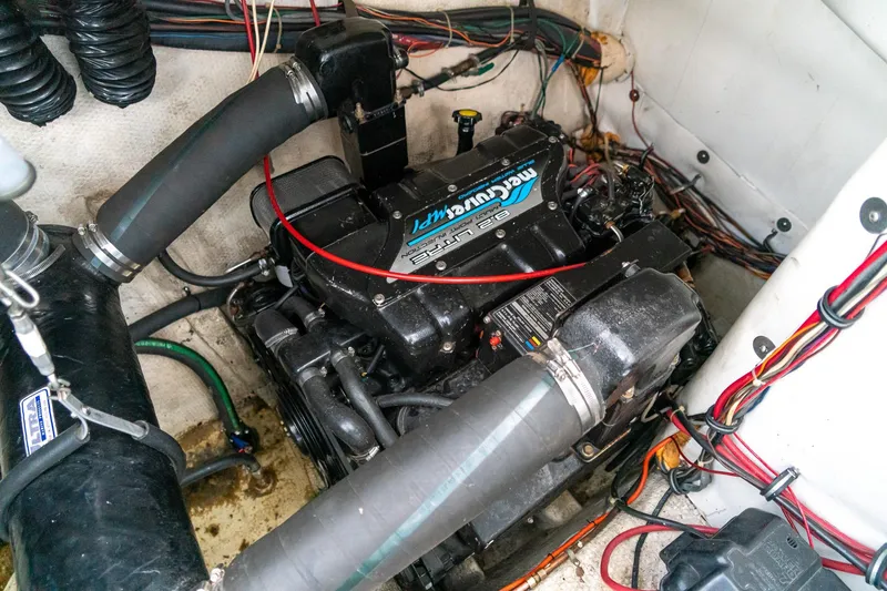 Slide: The Image of Engine compartment of a 1997 Harbor Master Stolkraft boat with visible wiring and components. - 56