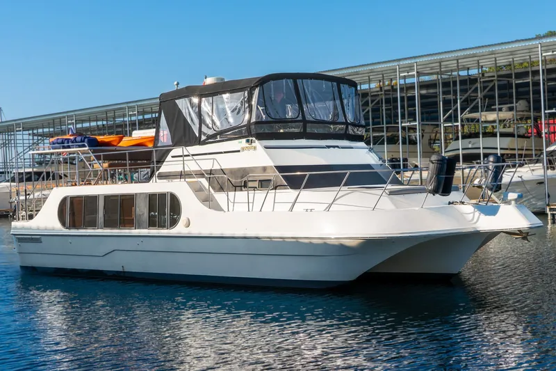 Slide: The Image of 1997 Harbor Master Stolkraft yacht docked at marina under clear blue sky. - 8