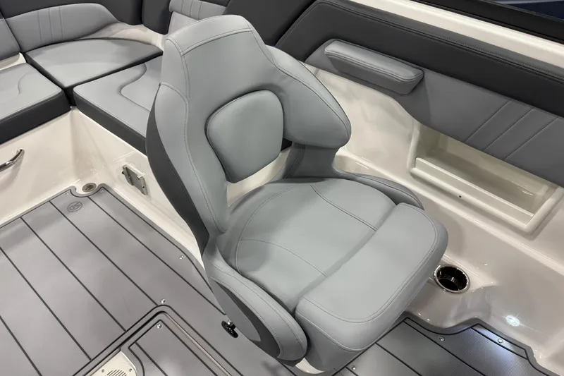 Slide: The Image of 2026 Chaparral 23 SSi boat interior with gray seating and modern design. - 38