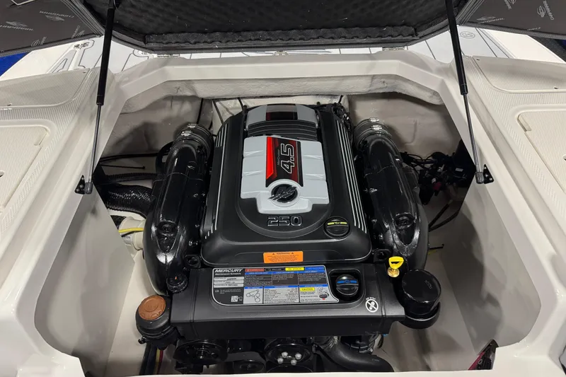Slide: The Image of 2026 Chaparral 23 SSi boat engine compartment with Mercury 4.5L 250 HP engine. - 42