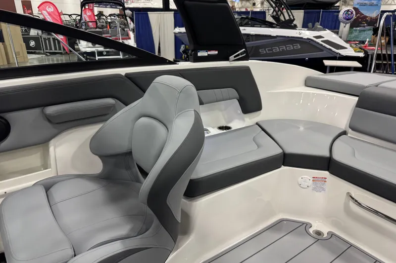 Slide: The Image of 2026 Chaparral 23 SSi boat interior with gray seating and modern design. - 49