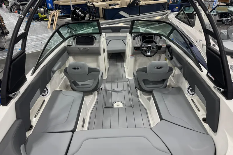 Slide: The Image of 2026 Chaparral 23 SSi boat interior with sleek gray seating and modern dashboard design. - 58