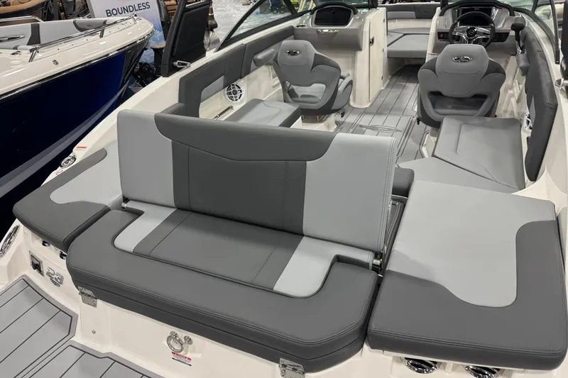 Slide: The Image of 2026 Chaparral 23 SSi boat interior with gray seating and modern dashboard design. - 61