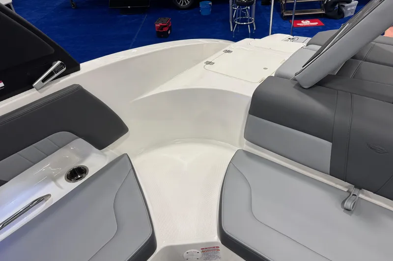Slide: The Image of Interior of 2026 Chaparral 23 SSi boat with gray seating and cup holder. - 62