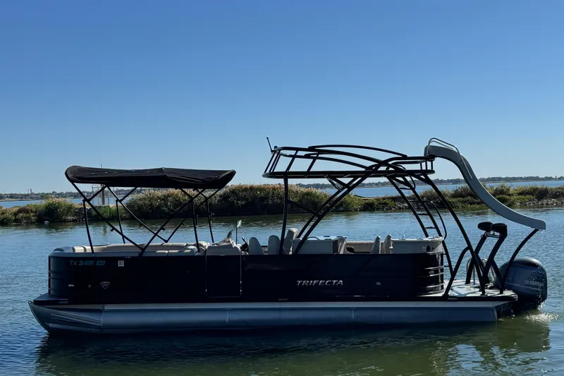 The Image of 2018 Trifecta SS 27RFE UDS XR pontoon boat with slide on calm water. - 0