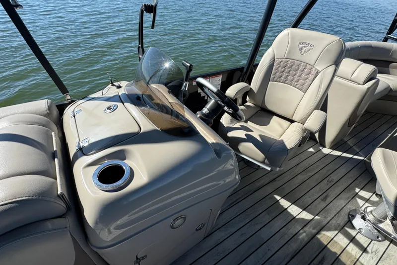 Slide: The Image of Captain's seat and console of 2018 Trifecta SS 27RFE UDS XR pontoon boat. - 12