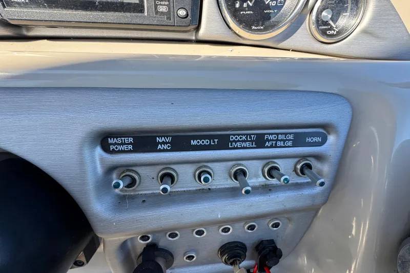 Slide: The Image of Control panel of a 2018 Trifecta SS 27RFE UDS XR boat with labeled switches. - 18