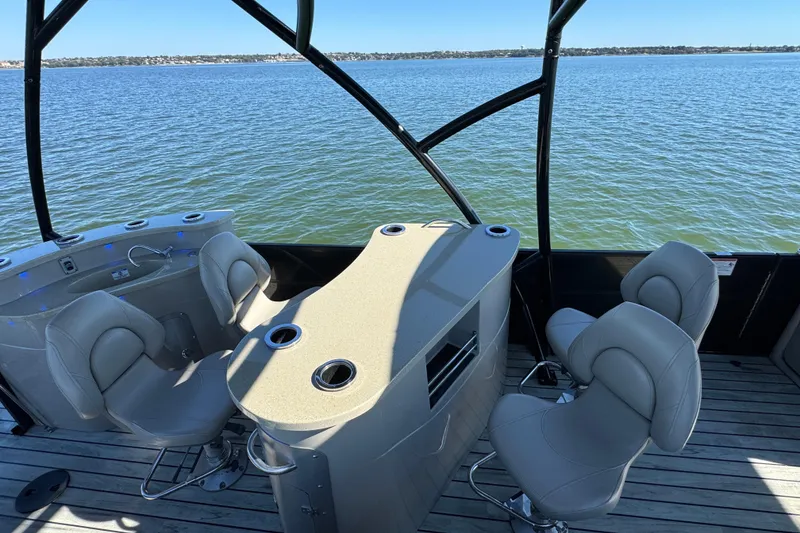 Slide: The Image of Luxurious 2018 Trifecta SS 27RFE UDS XR boat interior with plush seating and scenic water view. - 21