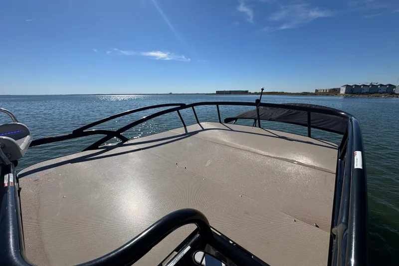 Slide: The Image of 2018 Trifecta SS 27RFE UDS XR boat on calm water under clear blue sky. - 24