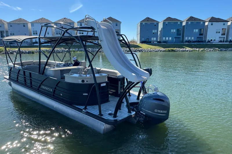 Slide: The Image of 2018 Trifecta SS 27RFE UDS XR pontoon boat with slide on a sunny lake. - 7