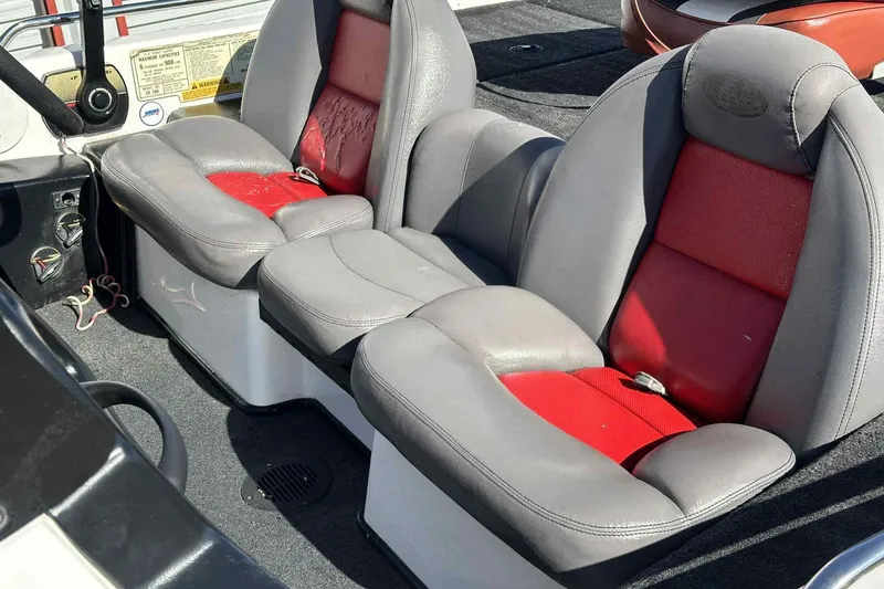 Slide: The Image of 2003 Skeeter ZX200 boat interior with gray and red seating. - 23