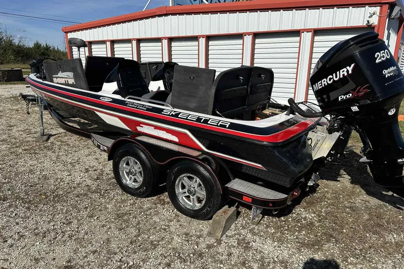 Slide: The Image of 2003 Skeeter ZX200 boat with Mercury Pro XS engine, parked on a trailer. - 28