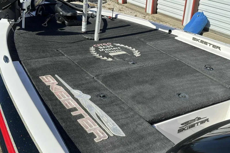 Slide: The Image of 2003 Skeeter ZX200 boat deck with logo and tournament emblem. - 4