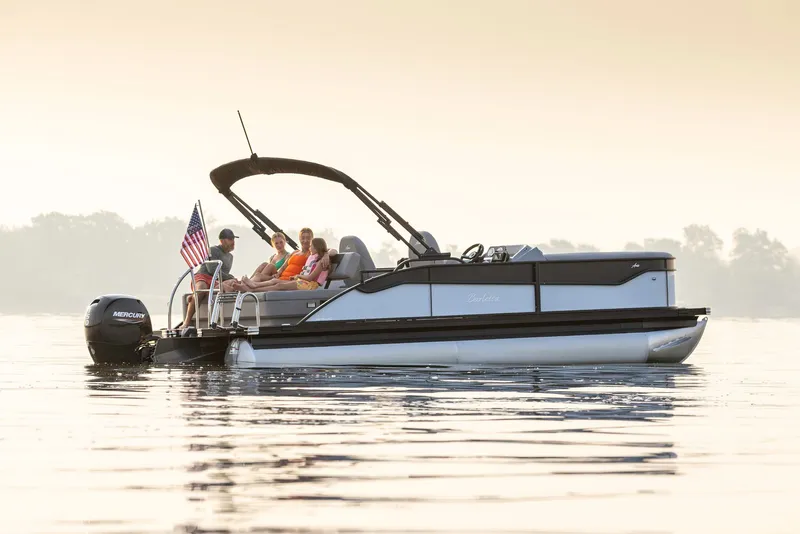 Slide: The Image of Barletta Aria 22 UC 2026 pontoon boat on calm water at sunset. - 3