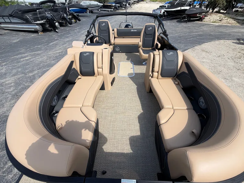 Slide: The Image of The image shows the interior of a 2026 Barletta CABRIO 22 UC boat with beige seating. - 14