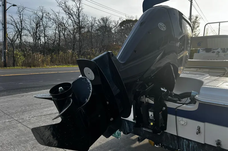 Slide: The Image of 2016 Carolina Skiff EV218 Sea Skiff outboard motor, parked on a roadside. - 4