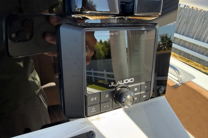 Slide: The Image of JL Audio MediaMaster 50 on 2023 Sea Hunt Ultra 234 boat dashboard. - 18