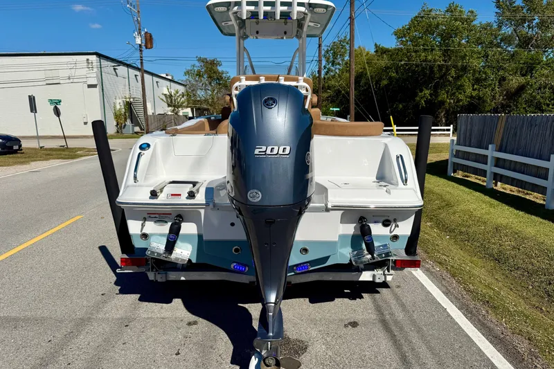 Slide: The Image of 2023 Sea Hunt Ultra 234 boat with Yamaha 200 engine on a trailer. - 3