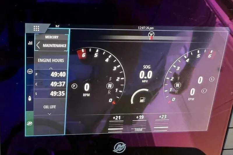 Slide: The Image of Dashboard display of 2024 Tiara Yachts 38 LS showing engine hours and RPM gauges. - 25