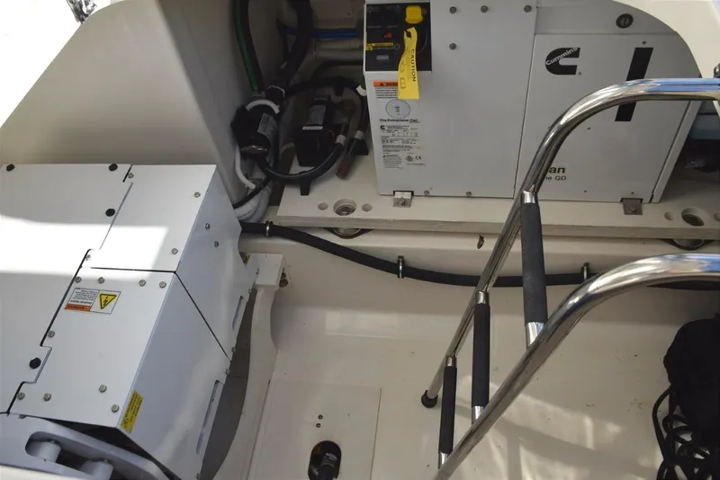 Slide: The Image of Engine compartment of 2024 Tiara Yachts 38 LS with Cummins/Onan diesel generator and SeaKeeper gyro stabilizer. - 36