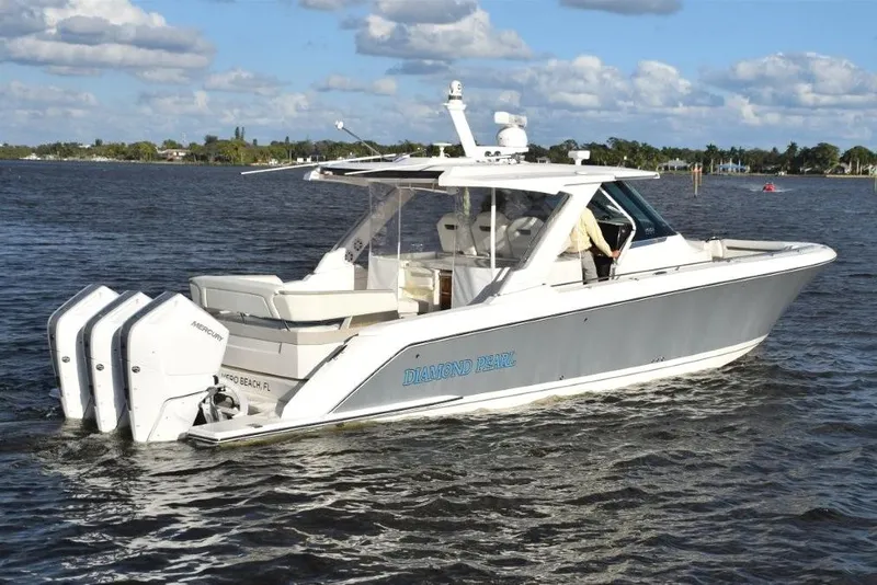 Slide: The Image of Easy to get around the boat with integral handrails forward. Dive ladder clips on platform starboard side aft. - 42