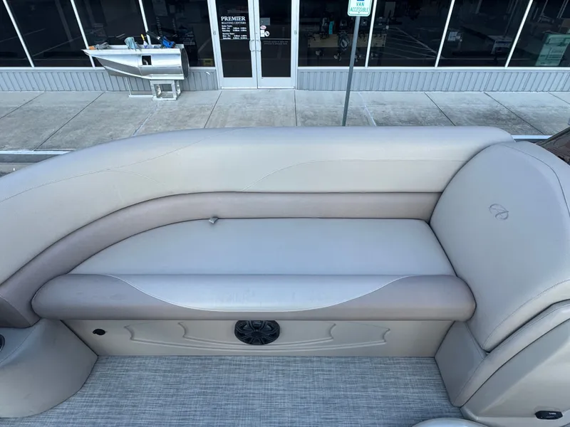 Slide: The Image of 2017 Avalon LSZ rf 2285 boat interior with beige seating and speaker. - 10
