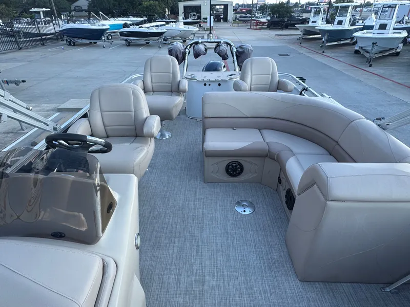 Slide: The Image of 2017 Avalon LSZ rf 2285 pontoon boat with beige seating and steering console. - 11