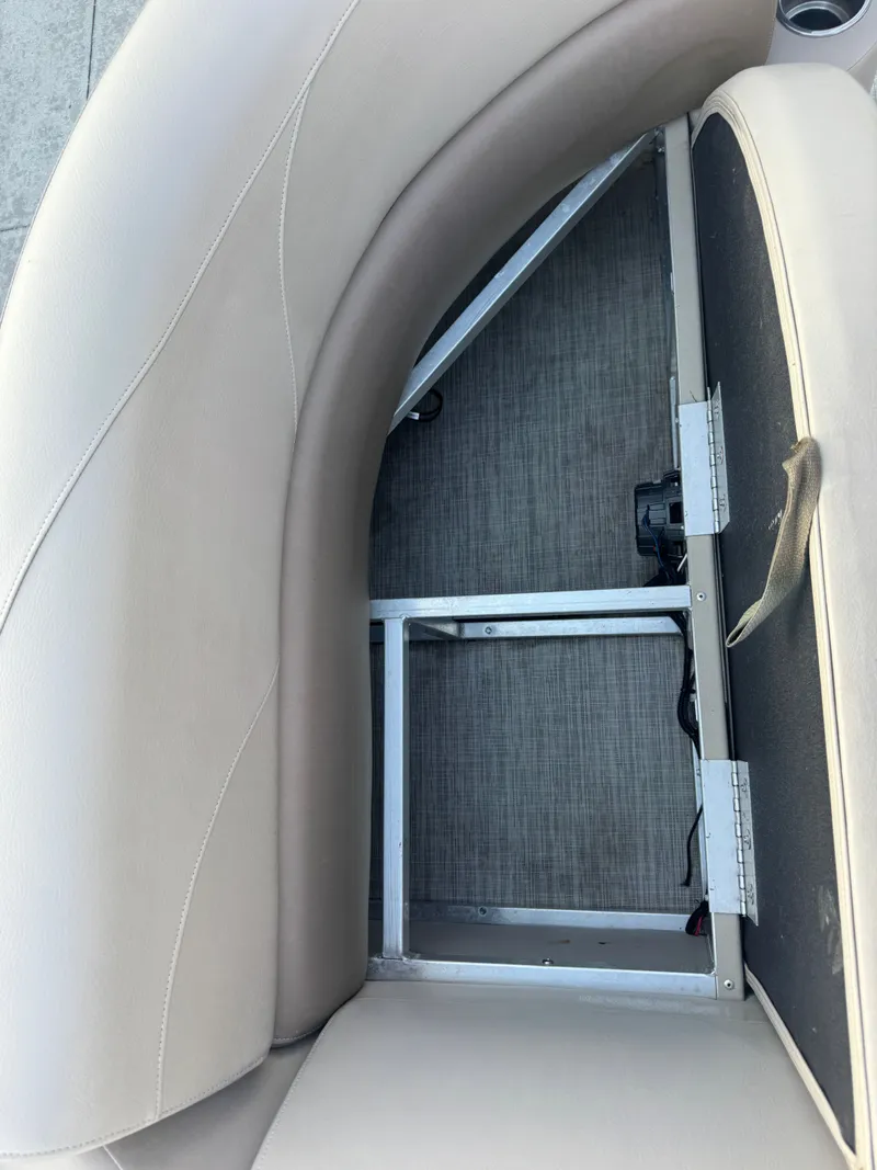 Slide: The Image of 2017 Avalon LSZ rf 2285 boat seat storage compartment with open lid. - 16