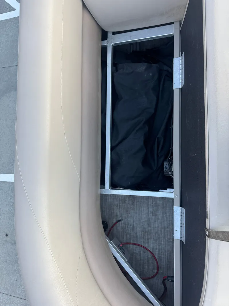 Slide: The Image of Open storage compartment in 2017 Avalon LSZ rf 2285 boat seat. - 17