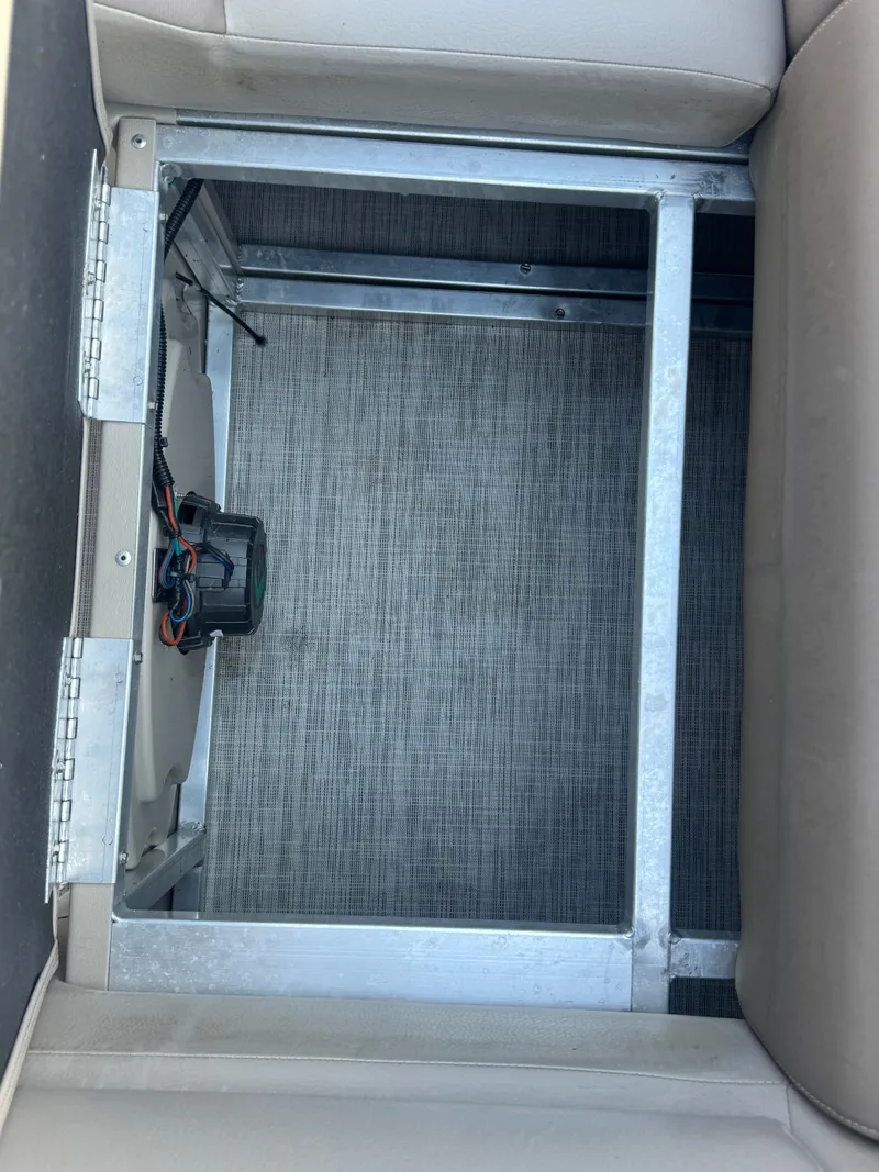 Slide: The Image of Open storage compartment in Avalon LSZ rf 2285 boat, 2017 model, with visible wiring. - 25