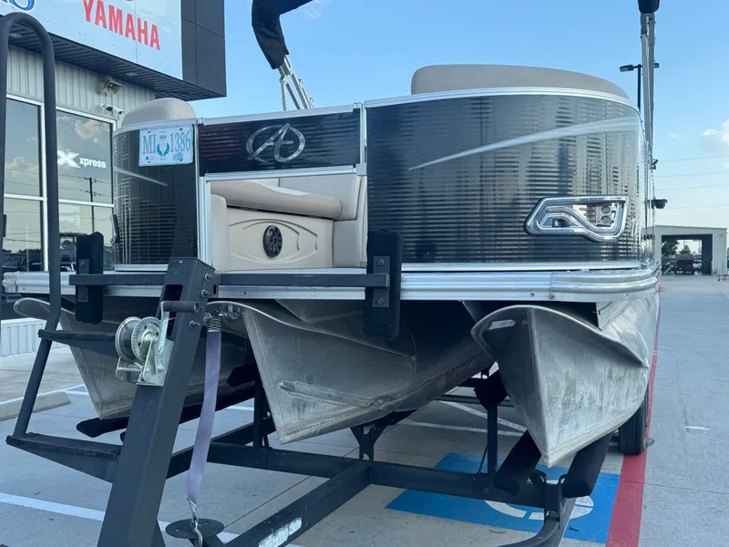 Slide: The Image of 2017 Avalon LSZ rf 2285 pontoon boat on trailer, parked outside Yamaha dealership. - 7