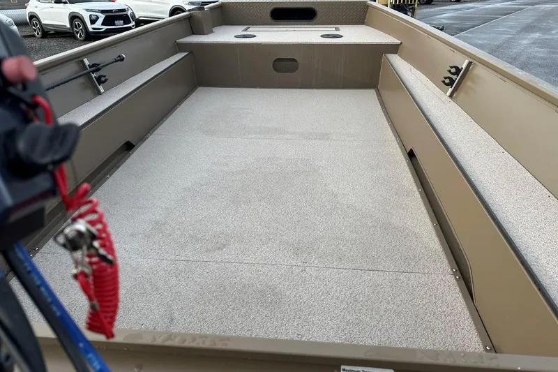 Slide: The Image of 2024 Smoker Craft Sportsman 1866 boat interior, featuring spacious deck and seating. - 4