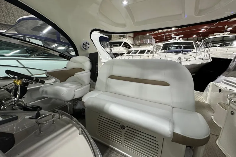 Slide: The Image of 2007 Sea Ray 44 Sundancer helm with advanced navigation and control systems. - 15