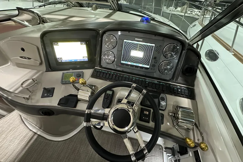 Slide: The Image of Dashboard of a 2007 Sea Ray 44 Sundancer with navigation and control instruments. - 17