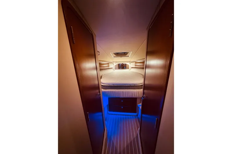 Slide: The Image of Luxurious 2007 Sea Ray 44 Sundancer yacht interior with elegant wooden table and plush seating. - 8