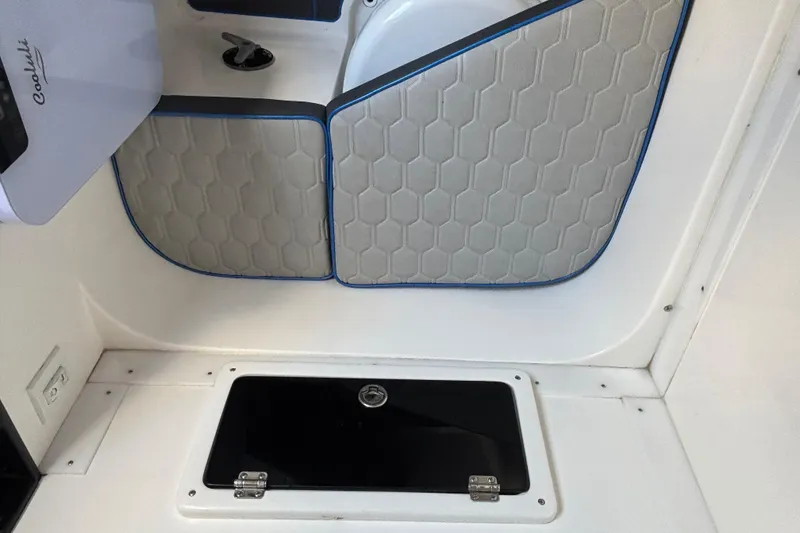 Slide: The Image of 2024 GSX 36 interior with hexagonal-patterned upholstery and storage compartment. - 11